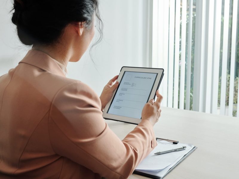 Young woman filling cv form
